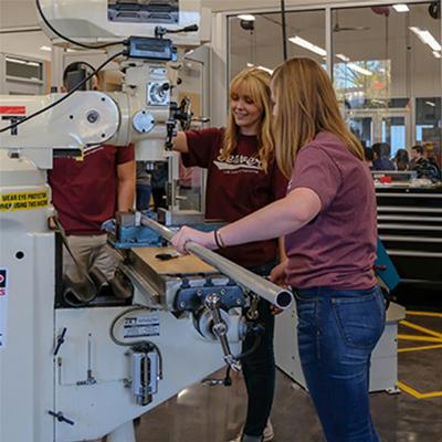 Two students working in a engineering lab.
